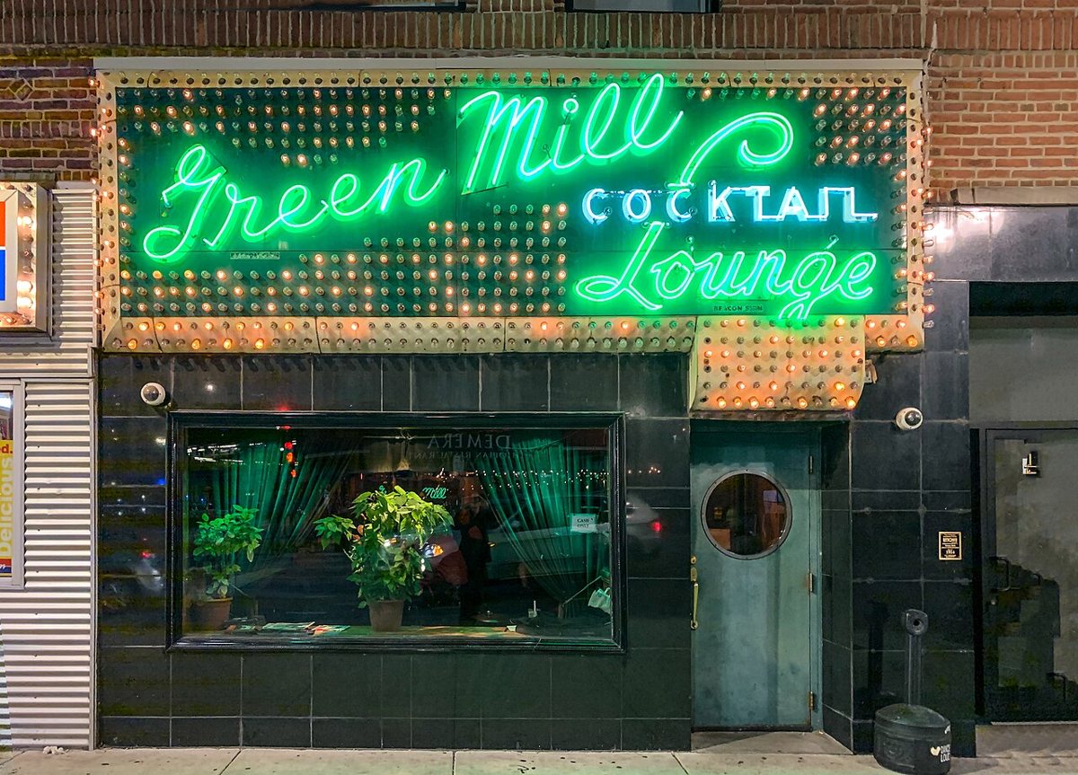 Neon sign outside the Green Mill jazz club in Uptown Chicago at night